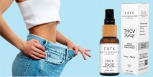 Woman shows weight loss in baggy jeans for THCV weight loss blog.