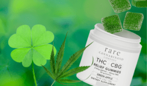 St. Patrick's Day: A four leaf clover is seen with a cannabis / hemp leaf and a jar of Rare Cannabinoid Company THC + CBG Relief Gummies.